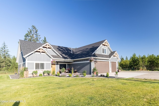 23426 N Massif Rd, Rathdrum, ID 83858 - craftsman-style house with board and batten siding, concrete driveway, a front lawn, and an attached garage