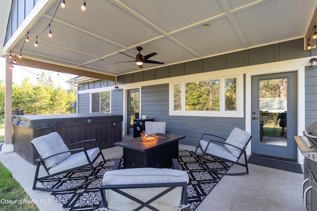 23426 N Massif Rd, Rathdrum, ID 83858 - view of patio featuring a hot tub, ceiling fan, and a fire pit