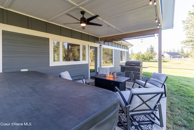 23426 N Massif Rd, Rathdrum, ID 83858 - view of patio / terrace with a ceiling fan, area for grilling, and an outdoor living space with a fire pit