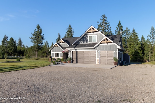 23426 N Massif Rd, Rathdrum, ID 83858 - craftsman-style house featuring board and batten siding, concrete driveway, a garage, and a front lawn