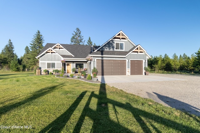 23426 N Massif Rd, Rathdrum, ID 83858 - craftsman house featuring board and batten siding, concrete driveway, and a front lawn