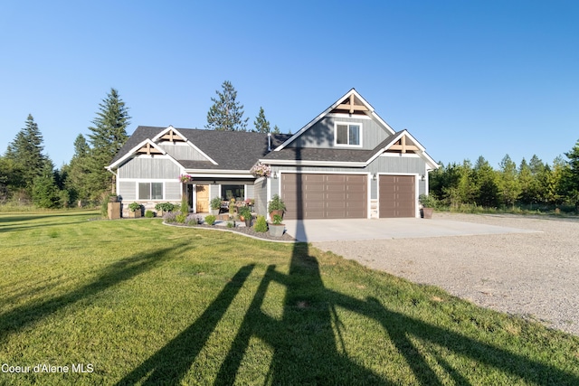 23426 N Massif Rd, Rathdrum, ID 83858 - craftsman house with board and batten siding, concrete driveway, a front yard, and an attached garage