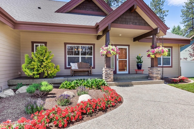 11477 N Rocking R Rd, Hayden, ID 83835 - view of exterior entry featuring covered porch and a shingled roof