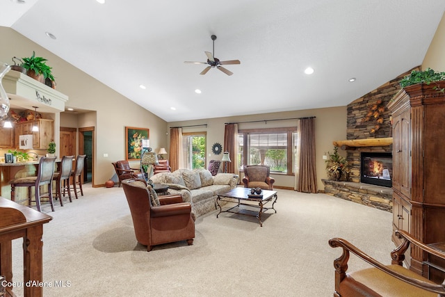 11477 N Rocking R Rd, Hayden, ID 83835 - living room featuring lofted ceiling, carpet floors, a ceiling fan, a stone fireplace, and recessed lighting