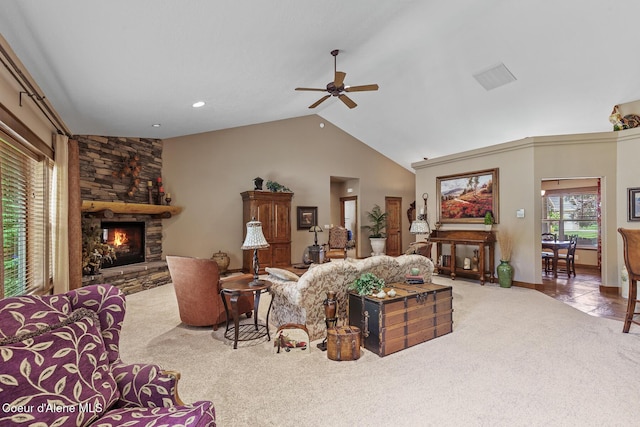 11477 N Rocking R Rd, Hayden, ID 83835 - living area featuring carpet floors, a ceiling fan, a stone fireplace, and high vaulted ceiling
