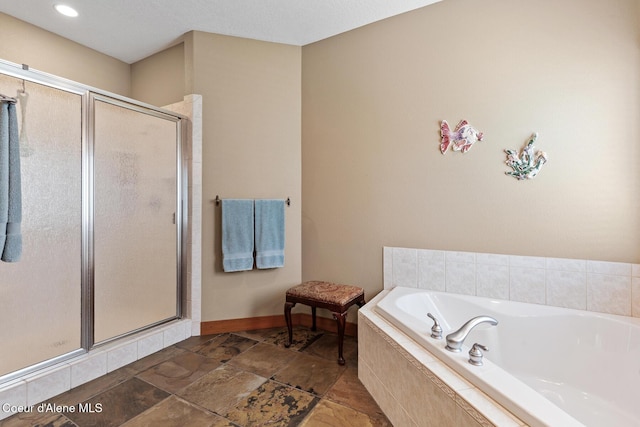 11477 N Rocking R Rd, Hayden, ID 83835 - full bath featuring a stall shower, a bath, and stone finish flooring