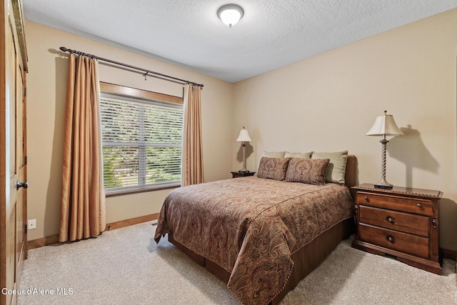 11477 N Rocking R Rd, Hayden, ID 83835 - bedroom with light colored carpet and a textured ceiling