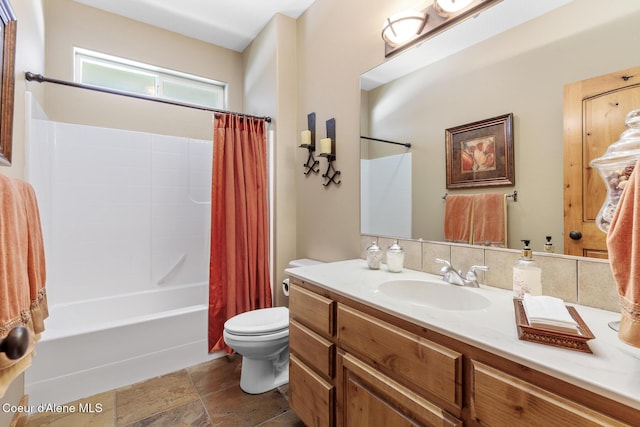 11477 N Rocking R Rd, Hayden, ID 83835 - full bath featuring vanity, shower / bathtub combination with curtain, and stone finish floors