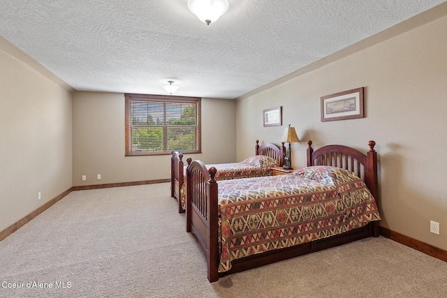 11477 N Rocking R Rd, Hayden, ID 83835 - bedroom with carpet floors and a textured ceiling