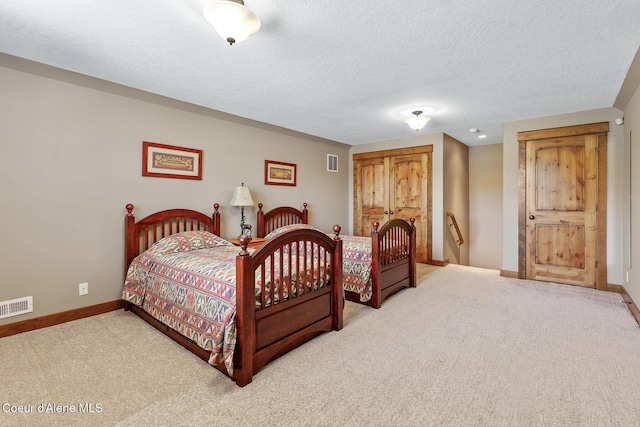 11477 N Rocking R Rd, Hayden, ID 83835 - carpeted bedroom with baseboards and a textured ceiling