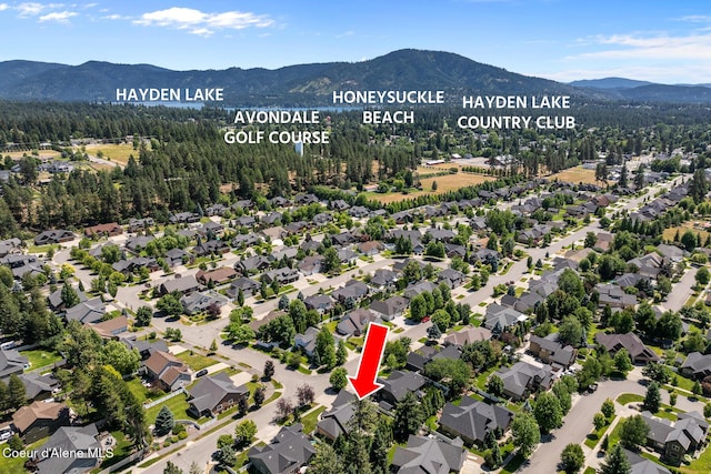 11477 N Rocking R Rd, Hayden, ID 83835 - aerial perspective of suburban area featuring a mountain backdrop