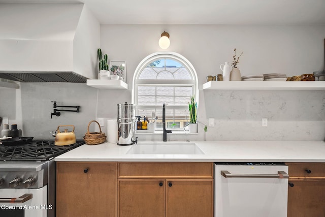 114 E Foster Ave, Coeur Dalene, ID 83814 - kitchen featuring gas range, white dishwasher, custom exhaust hood, light countertops, and brown cabinetry