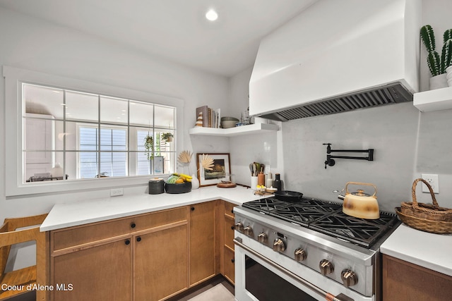 114 E Foster Ave, Coeur Dalene, ID 83814 - kitchen featuring stove, custom exhaust hood, light countertops, and recessed lighting