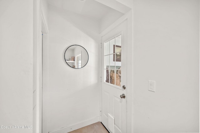 114 E Foster Ave, Coeur Dalene, ID 83814 - doorway with baseboards and light tile patterned floors