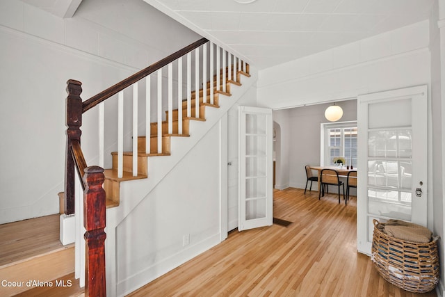 114 E Foster Ave, Coeur Dalene, ID 83814 - staircase with wood finished floors, french doors, and arched walkways