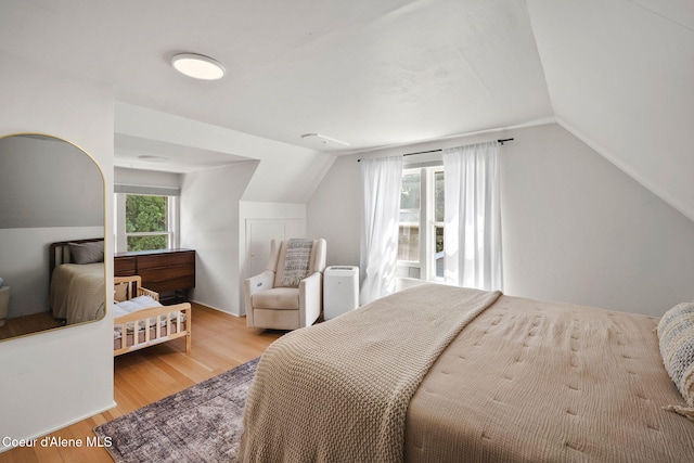 114 E Foster Ave, Coeur Dalene, ID 83814 - bedroom featuring vaulted ceiling and wood finished floors