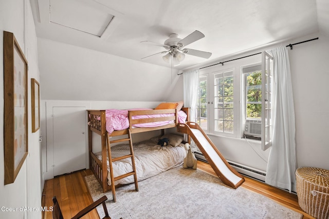 114 E Foster Ave, Coeur Dalene, ID 83814 - bedroom featuring wood finished floors, vaulted ceiling, attic access, a ceiling fan, and cooling unit