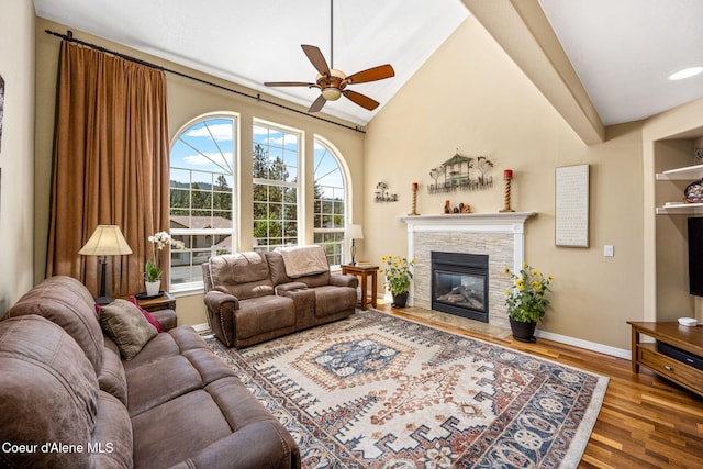 5570 E Shoreline Dr, Post Falls, ID 83854 - living area featuring ceiling fan, a fireplace, wood finished floors, and lofted ceiling