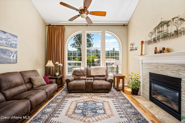 5570 E Shoreline Dr, Post Falls, ID 83854 - living area featuring ceiling fan, a fireplace, and wood finished floors