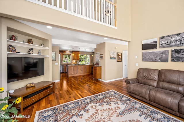 5570 E Shoreline Dr, Post Falls, ID 83854 - living room featuring dark wood finished floors and baseboards