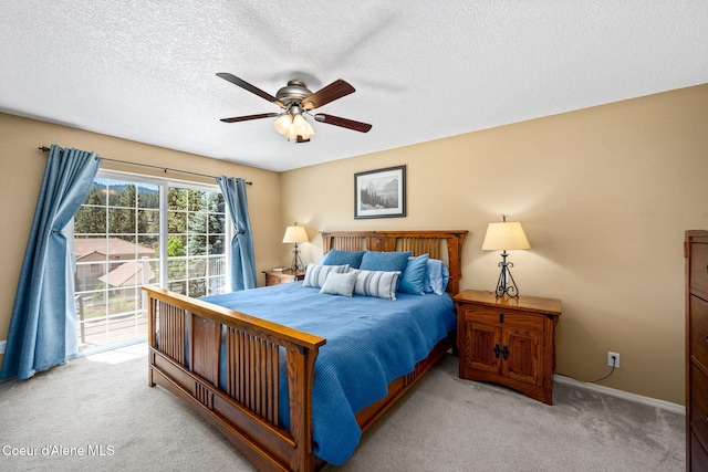 5570 E Shoreline Dr, Post Falls, ID 83854 - bedroom with light carpet, access to exterior, a textured ceiling, and ceiling fan