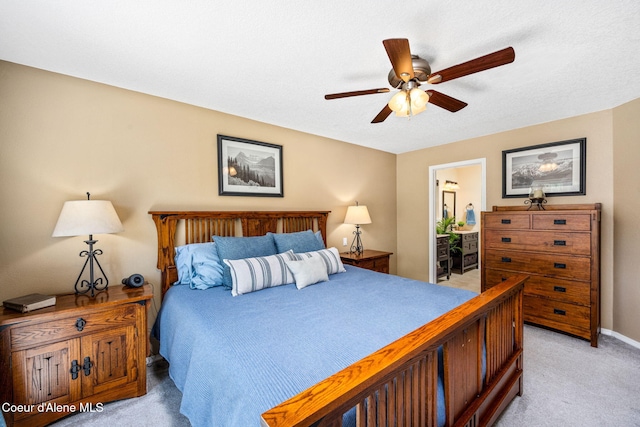 5570 E Shoreline Dr, Post Falls, ID 83854 - bedroom with light colored carpet, connected bathroom, and a ceiling fan