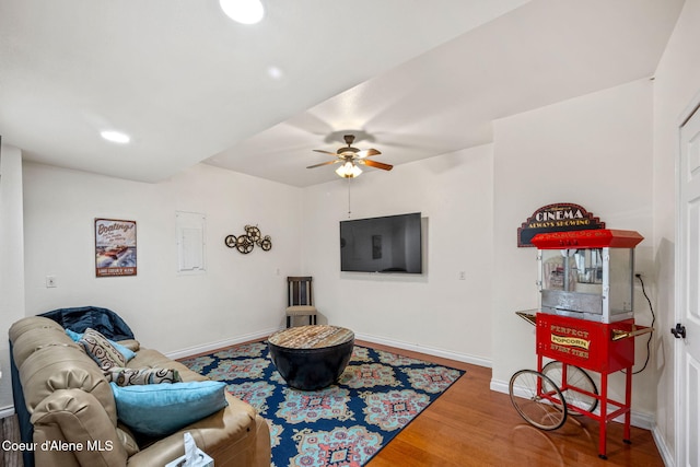5570 E Shoreline Dr, Post Falls, ID 83854 - living area featuring wood finished floors, a ceiling fan, electric panel, and recessed lighting