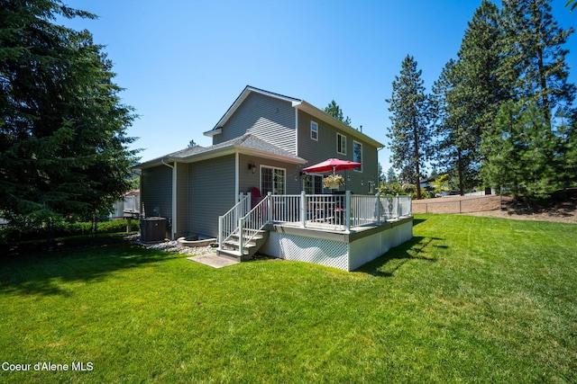 5570 E Shoreline Dr, Post Falls, ID 83854 - back of house featuring a deck and a yard