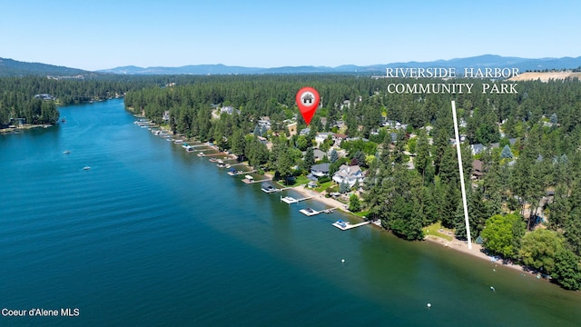 5570 E Shoreline Dr, Post Falls, ID 83854 - aerial view of a forest and a water and mountain view