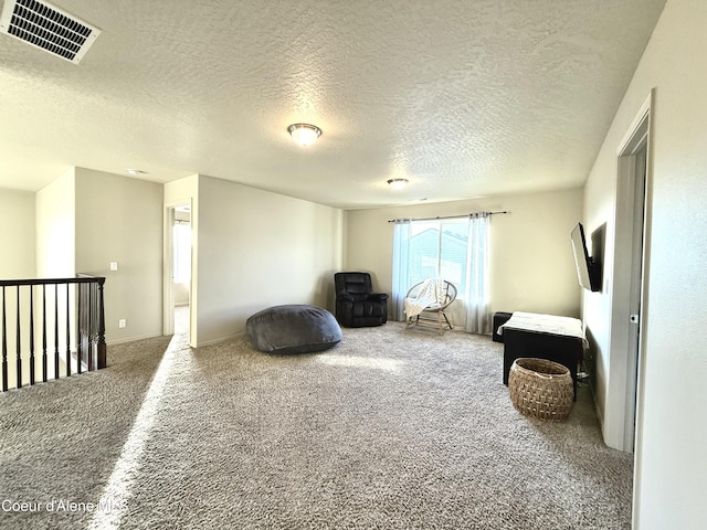 2699 E Thrush Dr, Post Falls, ID 83854 - living area featuring carpet and a textured ceiling