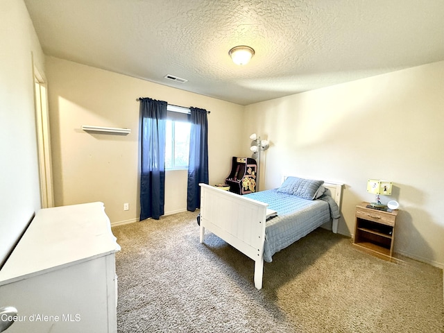 2699 E Thrush Dr, Post Falls, ID 83854 - bedroom featuring a textured ceiling and light colored carpet