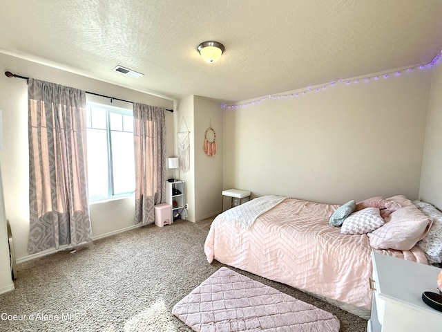 2699 E Thrush Dr, Post Falls, ID 83854 - carpeted bedroom with a textured ceiling and baseboards