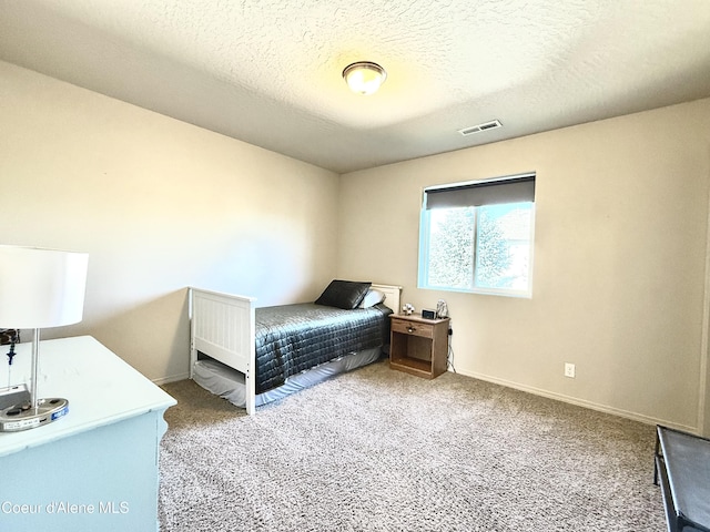 2699 E Thrush Dr, Post Falls, ID 83854 - bedroom featuring carpet and a textured ceiling