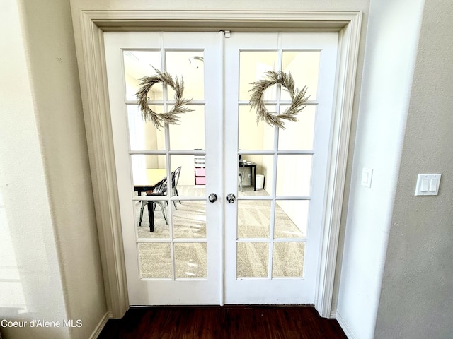 2699 E Thrush Dr, Post Falls, ID 83854 - doorway with french doors and dark wood-style floors