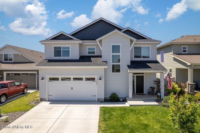 1839 N Skagit Dr, Post Falls, ID 83854 - craftsman house with driveway, an attached garage, and a front lawn
