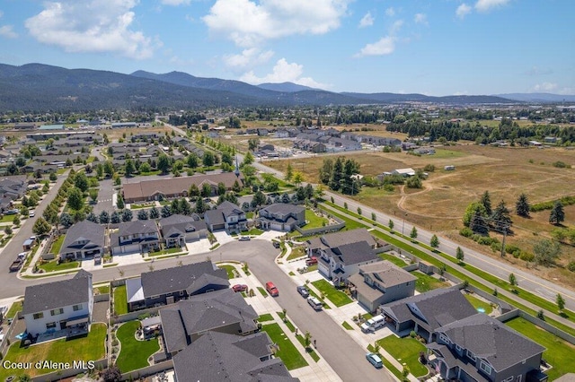 1839 N Skagit Dr, Post Falls, ID 83854 - aerial overview of property's location featuring a mountain backdrop and nearby suburban area