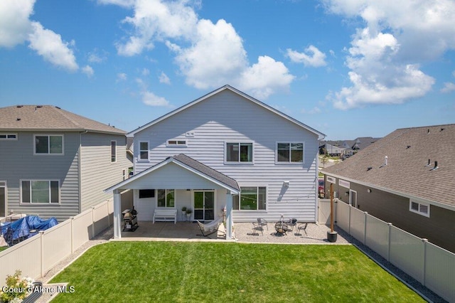 1839 N Skagit Dr, Post Falls, ID 83854 - back of property featuring a patio area and a fenced backyard