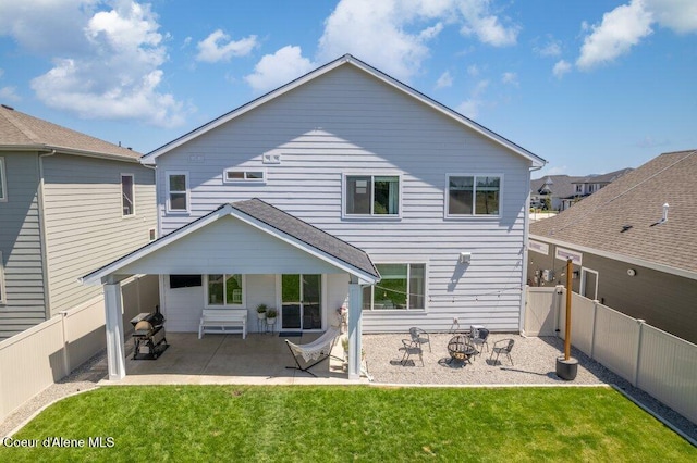 1839 N Skagit Dr, Post Falls, ID 83854 - rear view of property featuring a patio, a fenced backyard, and a gate