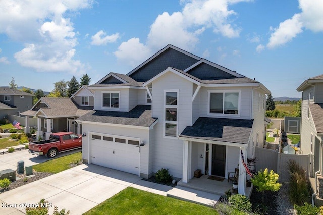 1839 N Skagit Dr, Post Falls, ID 83854 - craftsman-style home featuring concrete driveway, a shingled roof, and a garage