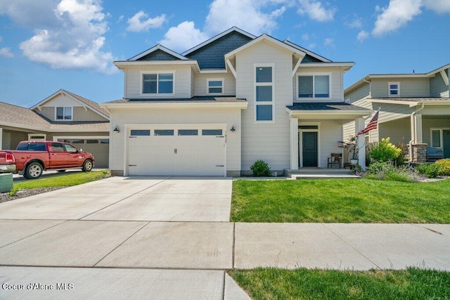 1839 N Skagit Dr, Post Falls, ID 83854 - craftsman-style home featuring concrete driveway, an attached garage, and a front yard