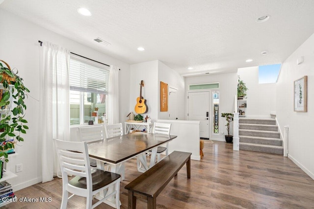 1839 N Skagit Dr, Post Falls, ID 83854 - dining room featuring wood finished floors, recessed lighting, a textured ceiling, and stairway