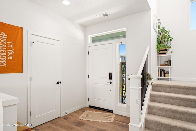 1839 N Skagit Dr, Post Falls, ID 83854 - foyer featuring stairway, wood finished floors, and plenty of natural light