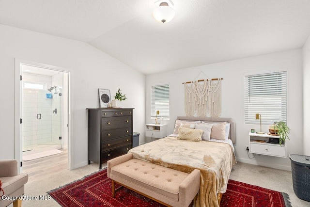 1839 N Skagit Dr, Post Falls, ID 83854 - bedroom featuring light colored carpet, vaulted ceiling, and ensuite bathroom