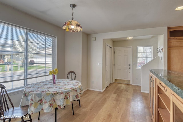 3789 N Steven Pl, Coeur Dalene, ID 83815 - dining space featuring light wood-style floors and baseboards
