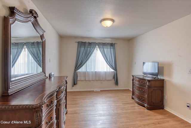 3789 N Steven Pl, Coeur Dalene, ID 83815 - bedroom featuring multiple windows and light wood-style floors