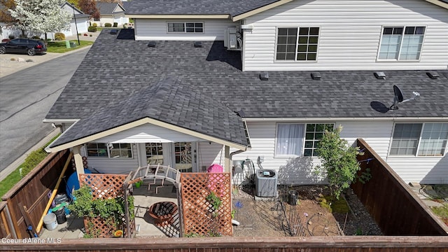 3789 N Steven Pl, Coeur Dalene, ID 83815 - rear view of house featuring roof with shingles