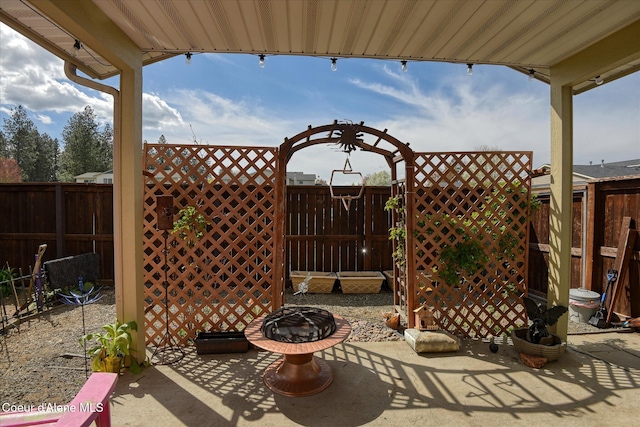 3789 N Steven Pl, Coeur Dalene, ID 83815 - fenced backyard featuring a patio area and an outdoor fire pit