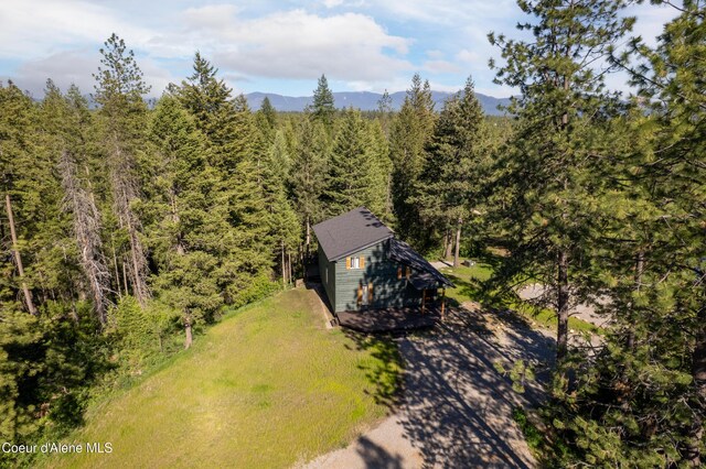 28729 Ramsey Rd, Athol, ID 83801 - view from above of property featuring a heavily wooded area and a mountainous background
