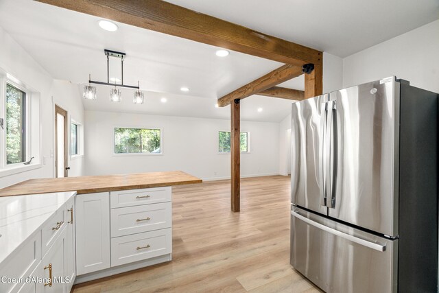 28729 Ramsey Rd, Athol, ID 83801 - kitchen featuring freestanding refrigerator, recessed lighting, light wood-style floors, pendant lighting, and white cabinetry