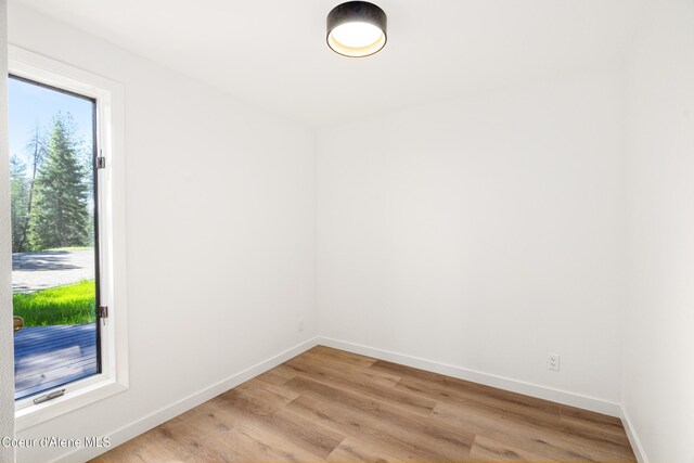 28729 Ramsey Rd, Athol, ID 83801 - empty room with baseboards and light wood-style floors